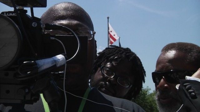 Photo of Levester Green working a camera.