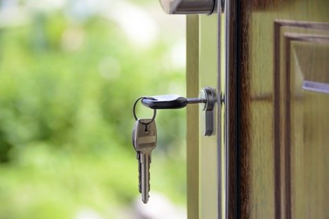 Key hanging in lock on door