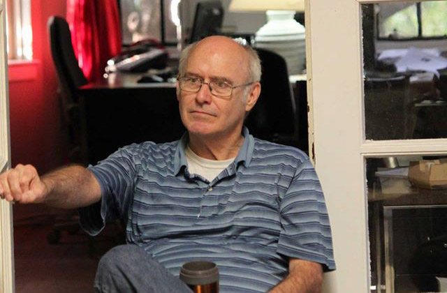 Michael Stoops sitting in the church basement office of the National Coalition for the Homeless.