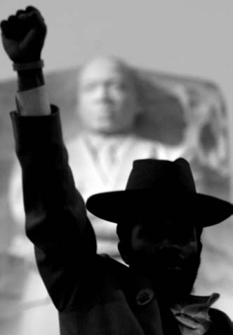 This gentleman’s identity remains unknown, only because he remained silent and motionless in this position for the hour our correspondent was present at the MLK memorial.