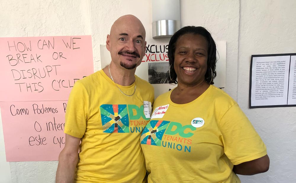 photo of two people in yellow matching t-shirts.