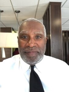 Wendell Williams in a McDonald's bathroom checking his appearance.
