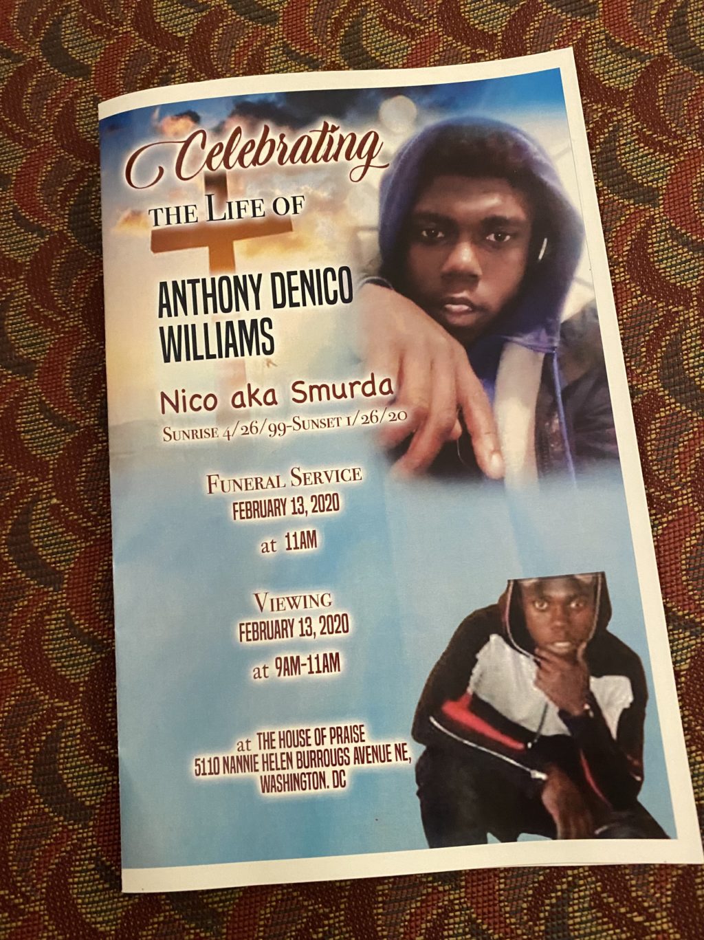 A funeral service program which includes photos of a young black man in a hoodie and his name and details about the funeral and viewing