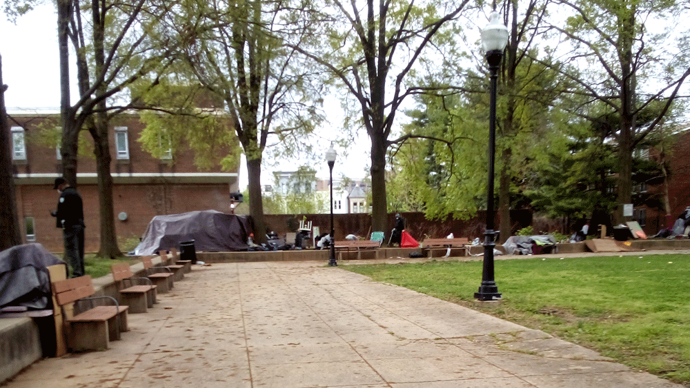 Photo showing several blankets and other belonging around the edges of the park