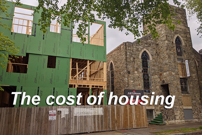 Photo of housing under construction next to a church. It is Jubilee Housing's latest project that will be designated for returning citizens.