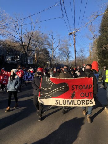 photo of protesters marching to Susan Rice's house