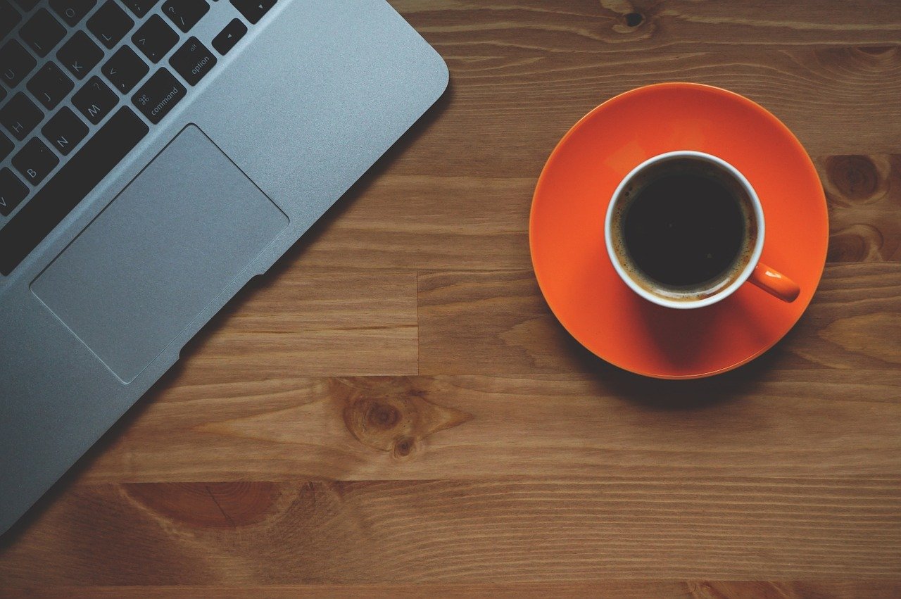 Image of a laptop computer and a cup of coffee.