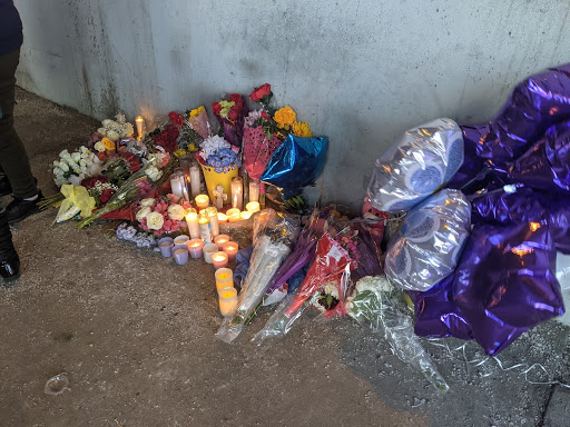 Candles, balloons and flowers placed at the John Philip Sousa Bridge underpass