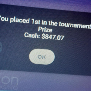 Image showing notification from winning tournament. "You placed 1st in the tournament. Prize Cash: $847.07." Below is a button that reads "OK."