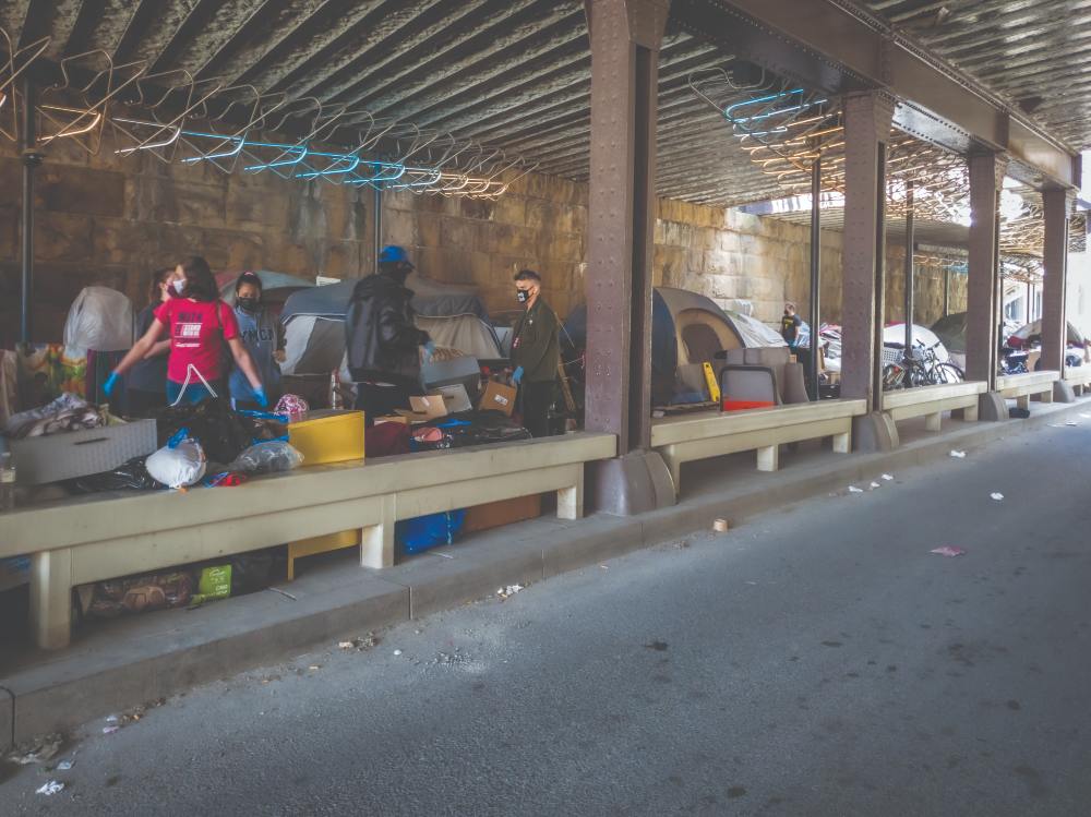 Volunteers and nonprofit employees help move residents