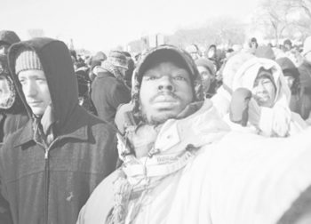 Reginald Black pauses to take a selfie of himself in the crowd