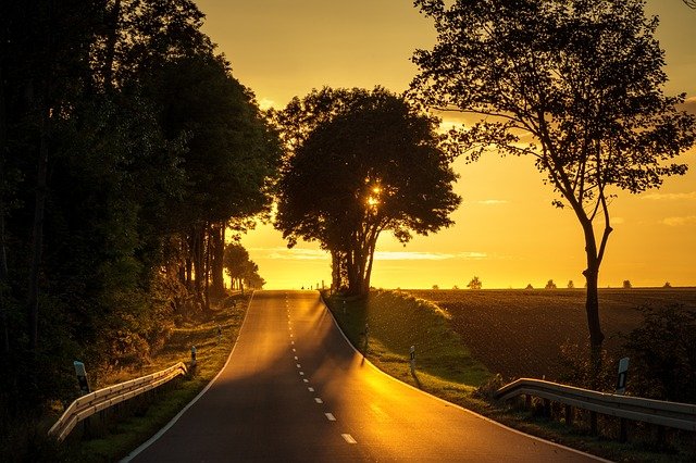 Photo of an empty road at sunset.