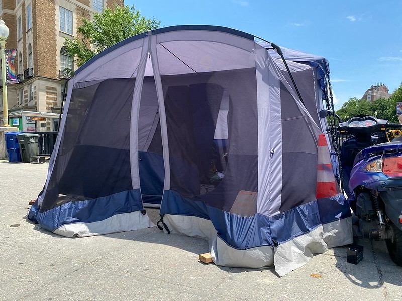 Photo of Mike's tent; his scooter is parked next to it.