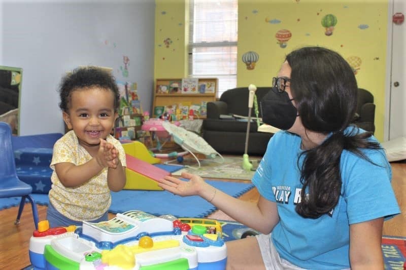A child poses for a photo during an activity table exercise