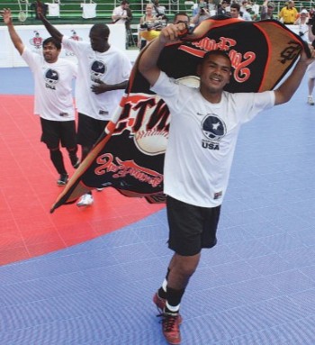 A player hoists a banner over his shoulders