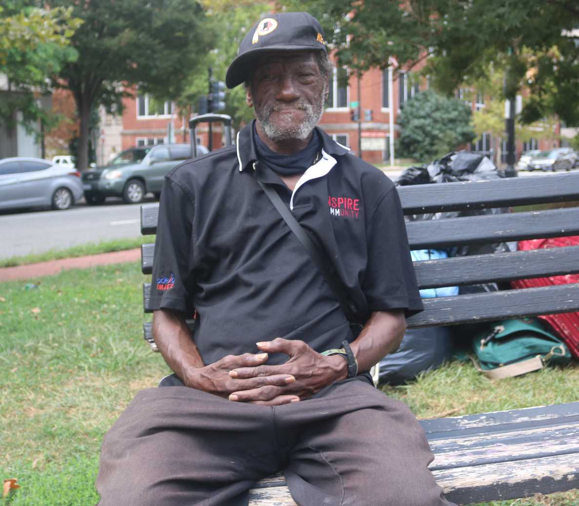 Photo of Robert Buchanan sitting on a park bench.