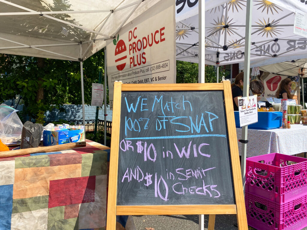 Signage at the Bloomingdale Market shows what benefits are accepted, Sep. 19, 2021.