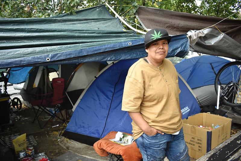 Ray is standing in the encampment