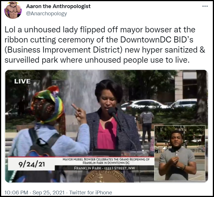 Embedded tweet shows a picture of homeless D.C. resident Chandra Brown flipping off Mayor Muriel Bowser
