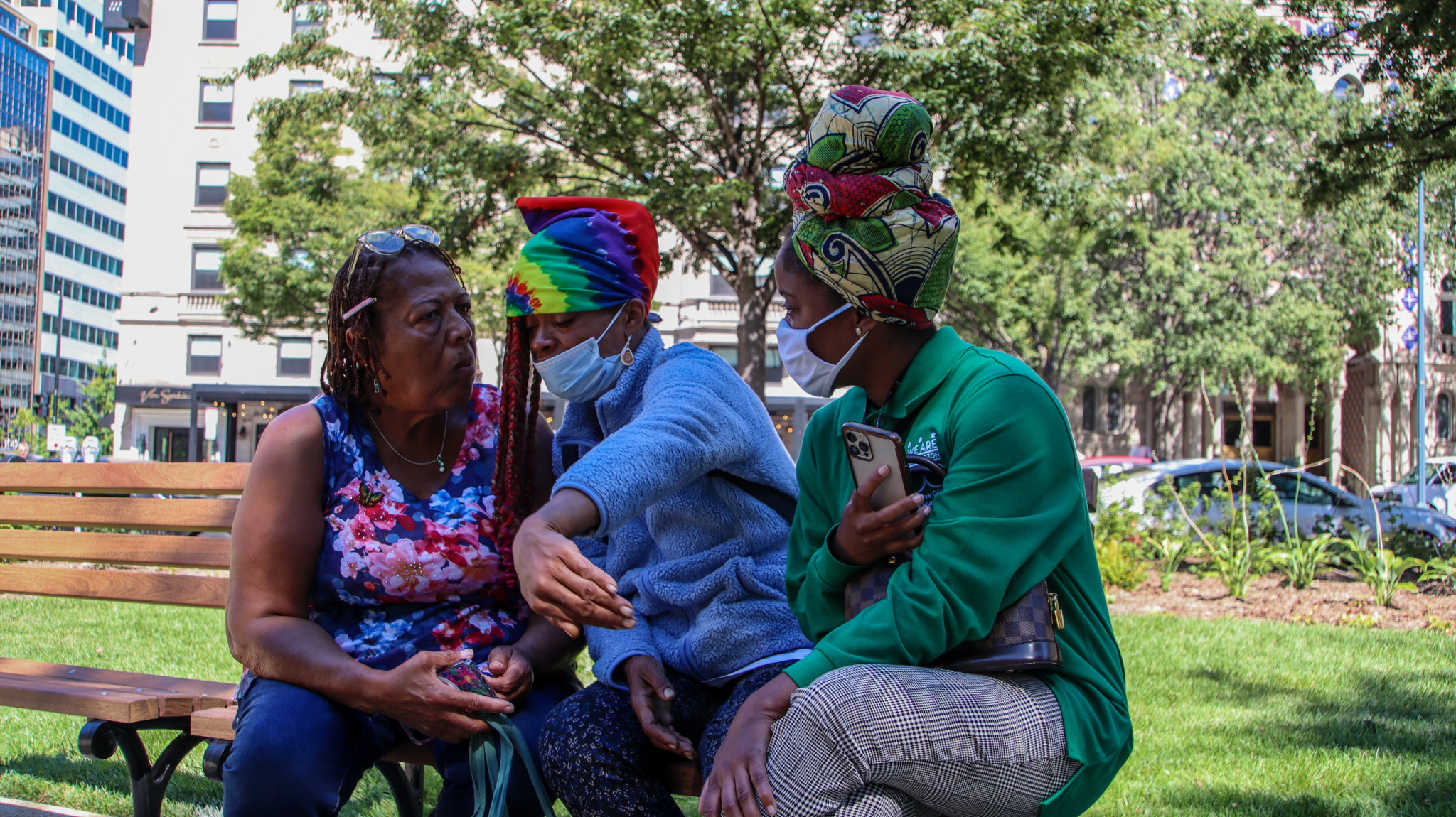 Homeless D.C. resident Chandra Brown (center) explaining her service needs to Ward 7 liaison Saudia Jenkins (right).